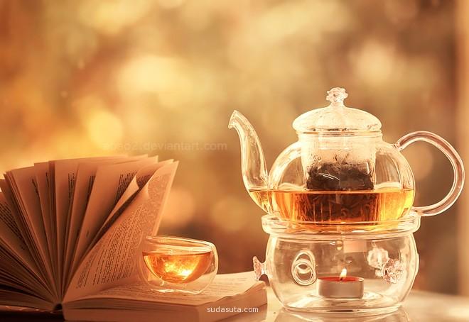 A cup, a kettle and a book. A perfect example of still life photo.